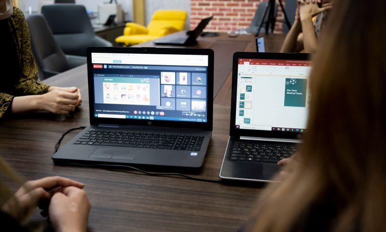 Team discusses projects during a virtual and in-person meeting in a Dubai office.