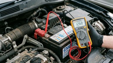 Diagnosing car battery draining overnight using a digital multimeter on fuse box