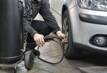 Inspecting four-digit tyre manufacturing date DOT stamp on tyre sidewall