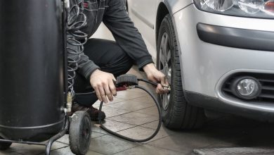Inspecting four-digit tyre manufacturing date DOT stamp on tyre sidewall