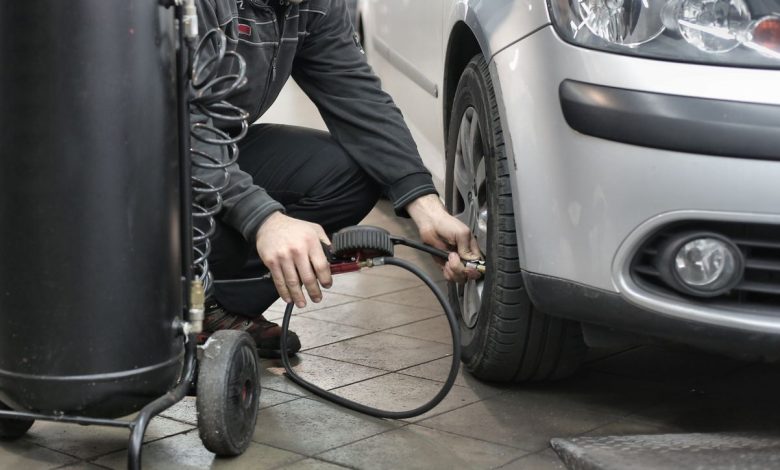 Inspecting four-digit tyre manufacturing date DOT stamp on tyre sidewall